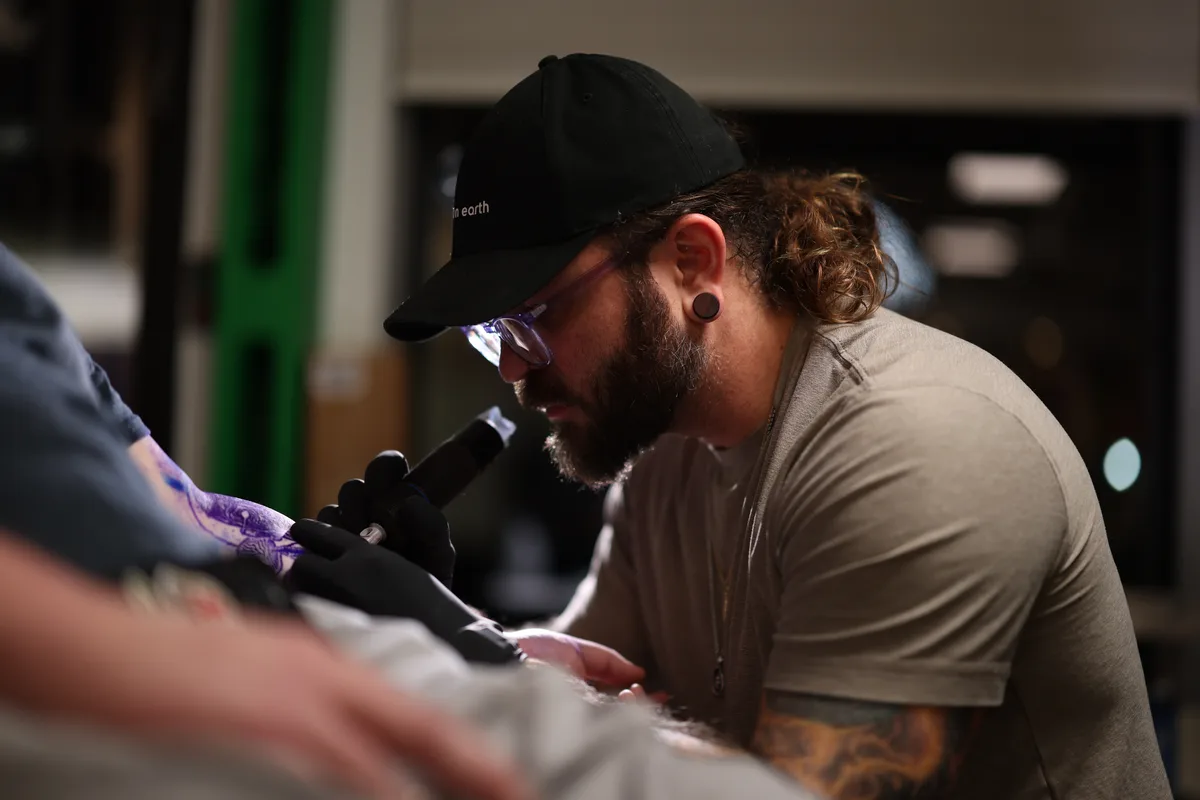 Bobby Cupparo tattooing close-up, focused on detail work