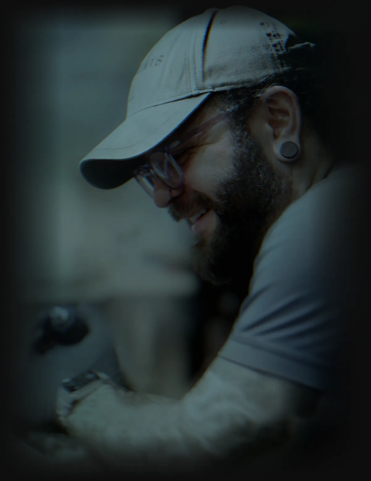 Bobby Cupparo smiling while tattooing — color realism artist at work
