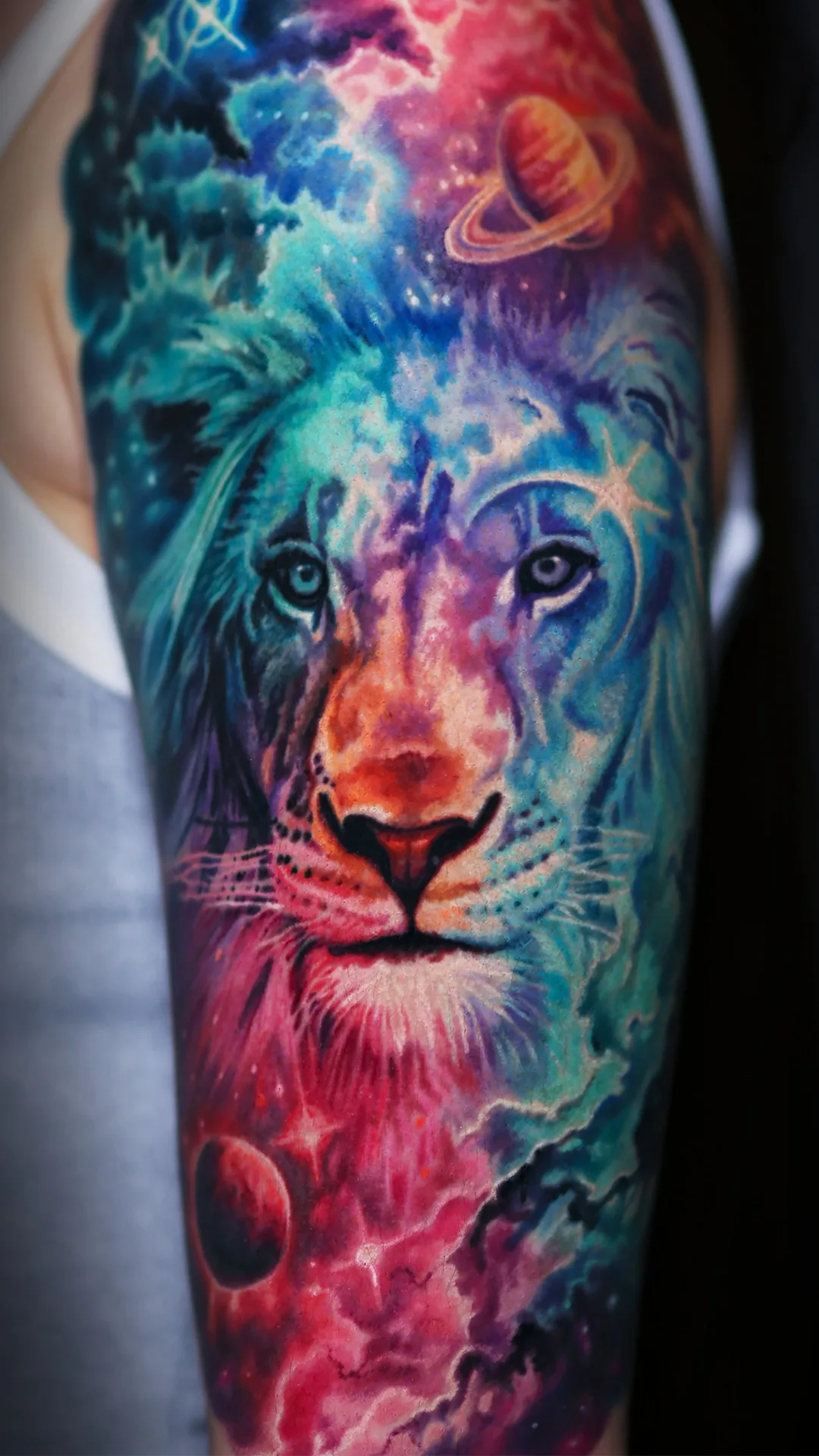 Healed surreal color galaxy lion saturn cosmic sleeve tattoo by Austin tattoo artist Bobby Cupparo