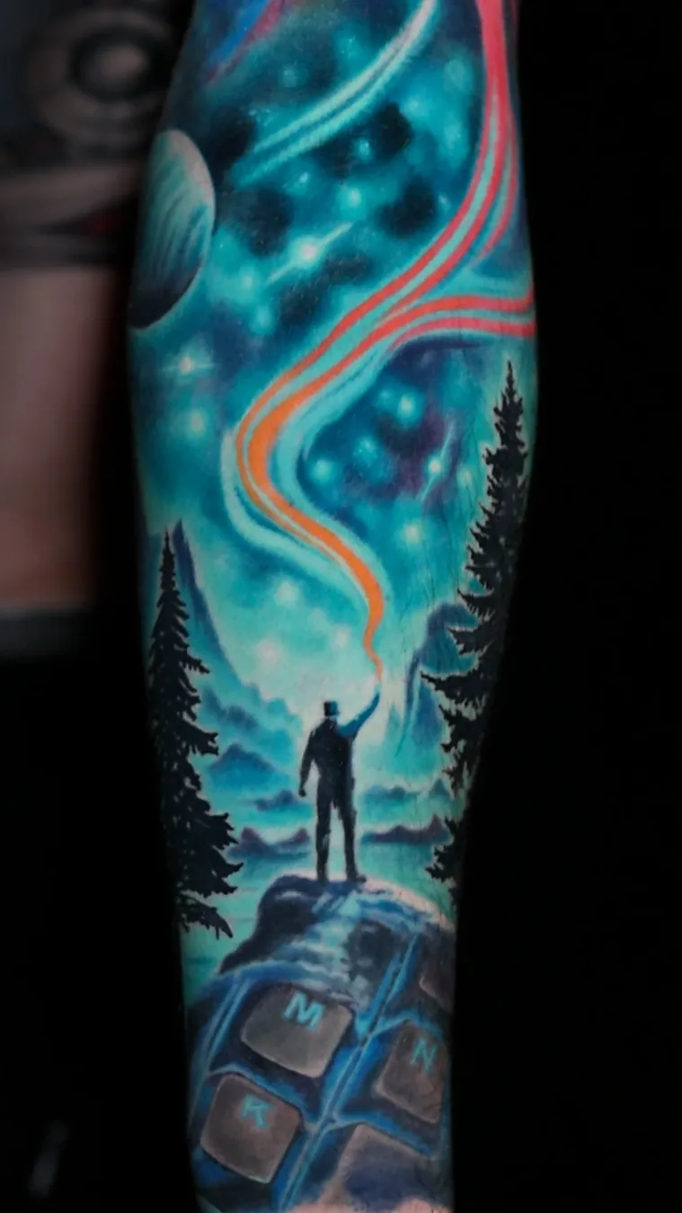 Healed surreal color galaxy nebula cosmic silhouette full sleeve tattoo by Austin tattoo artist Bobby Cupparo