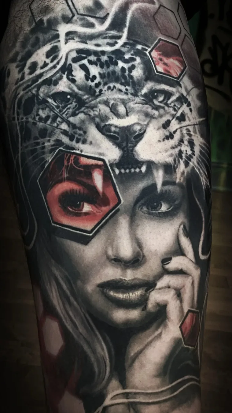Healed black and grey leopard headdress female portrait thigh tattoo by Austin tattoo artist Bobby Cupparo