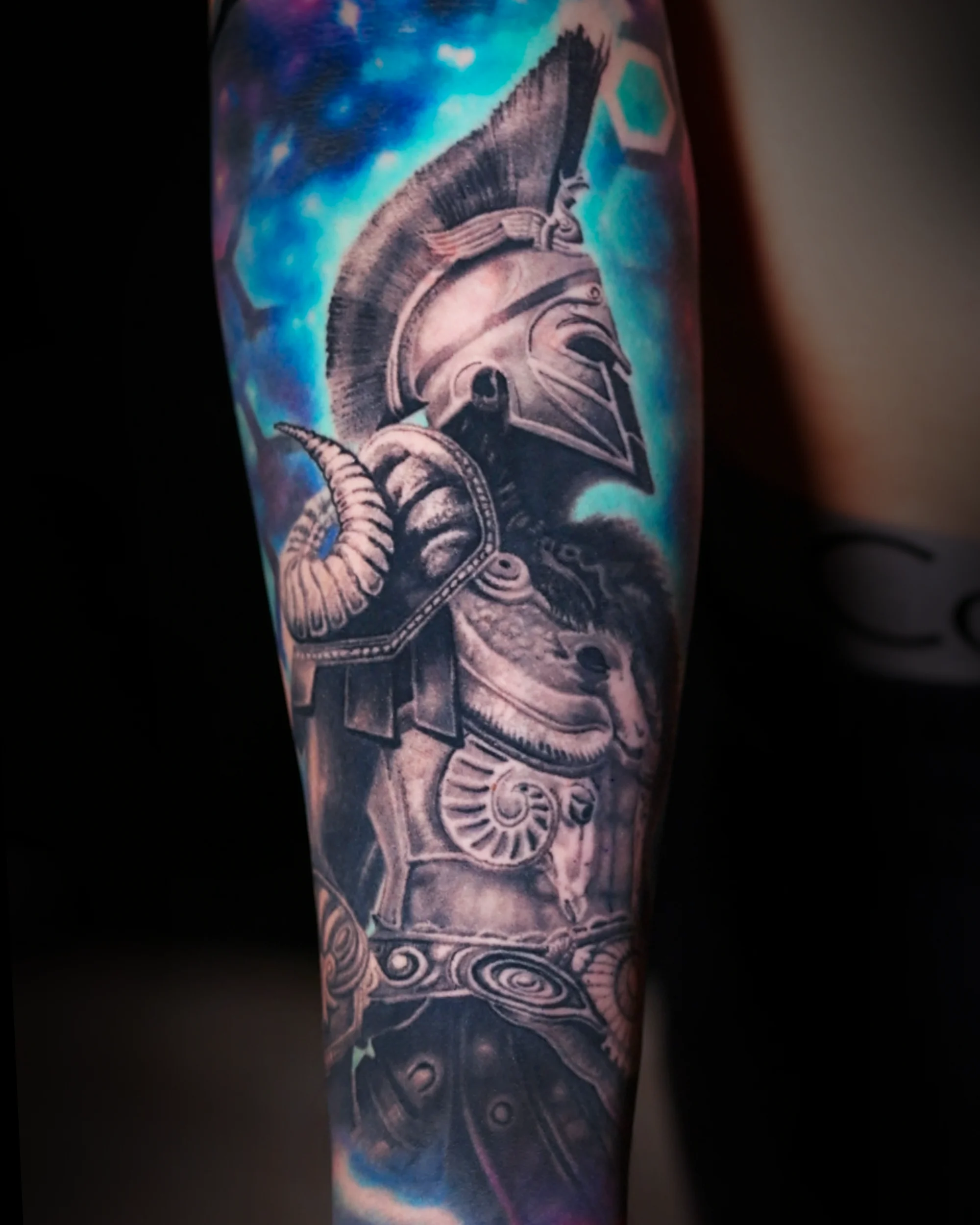 Black and grey Spartan warrior forearm tattoo by Austin tattoo artist Bobby Cupparo