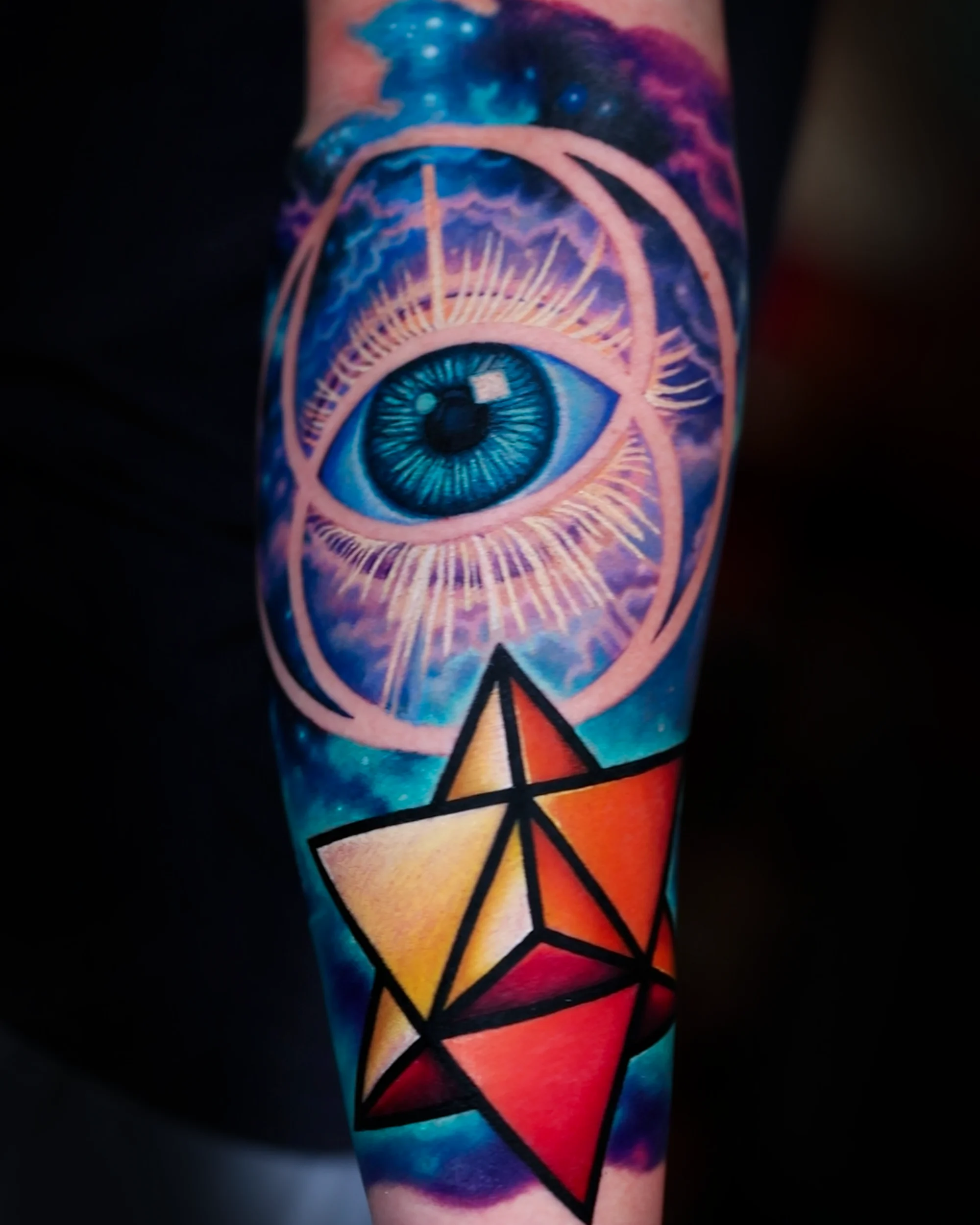 Color cosmic eye merkaba forearm tattoo by Austin tattoo artist Bobby Cupparo