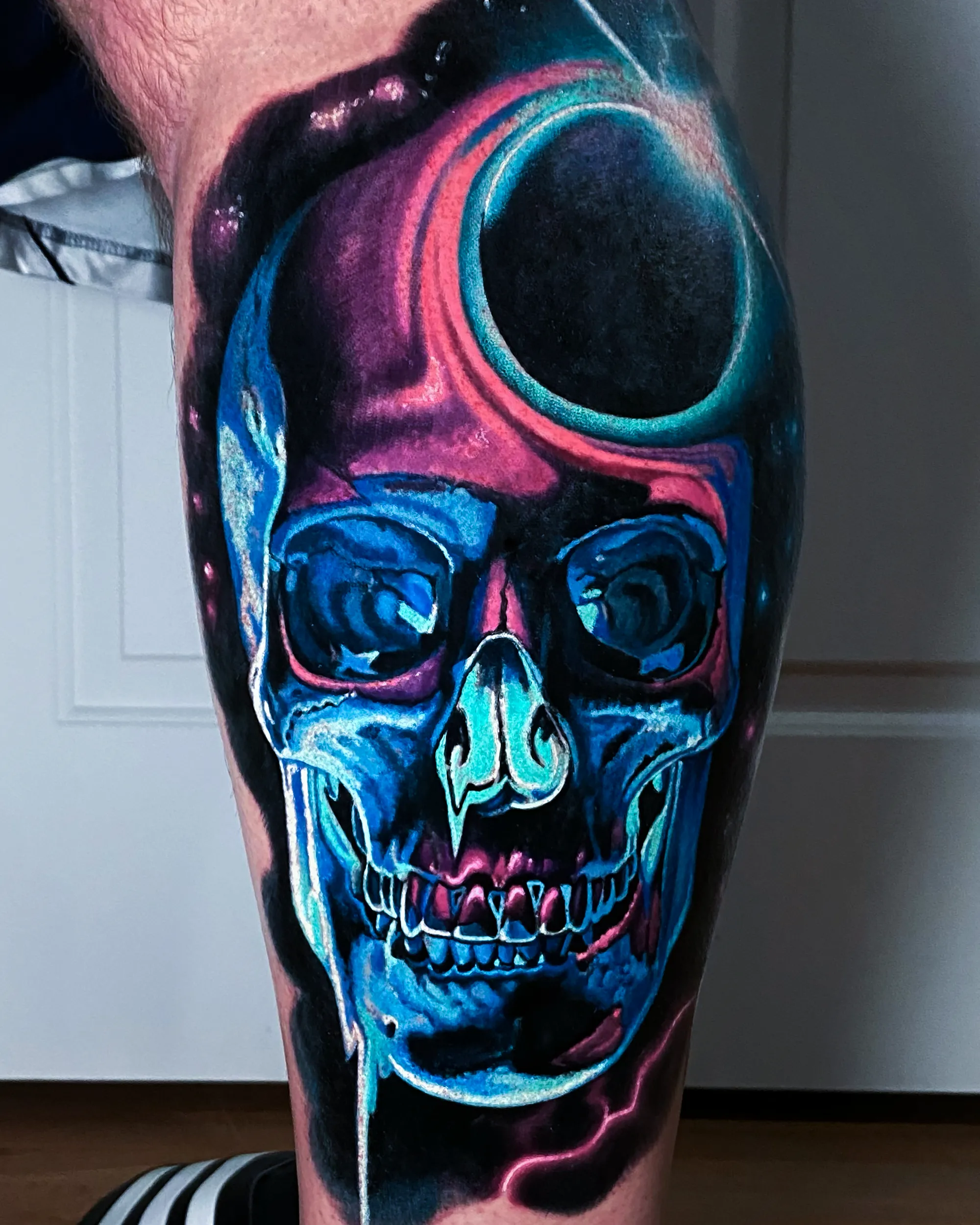 Galaxy skull drip leg sleeve tattoo