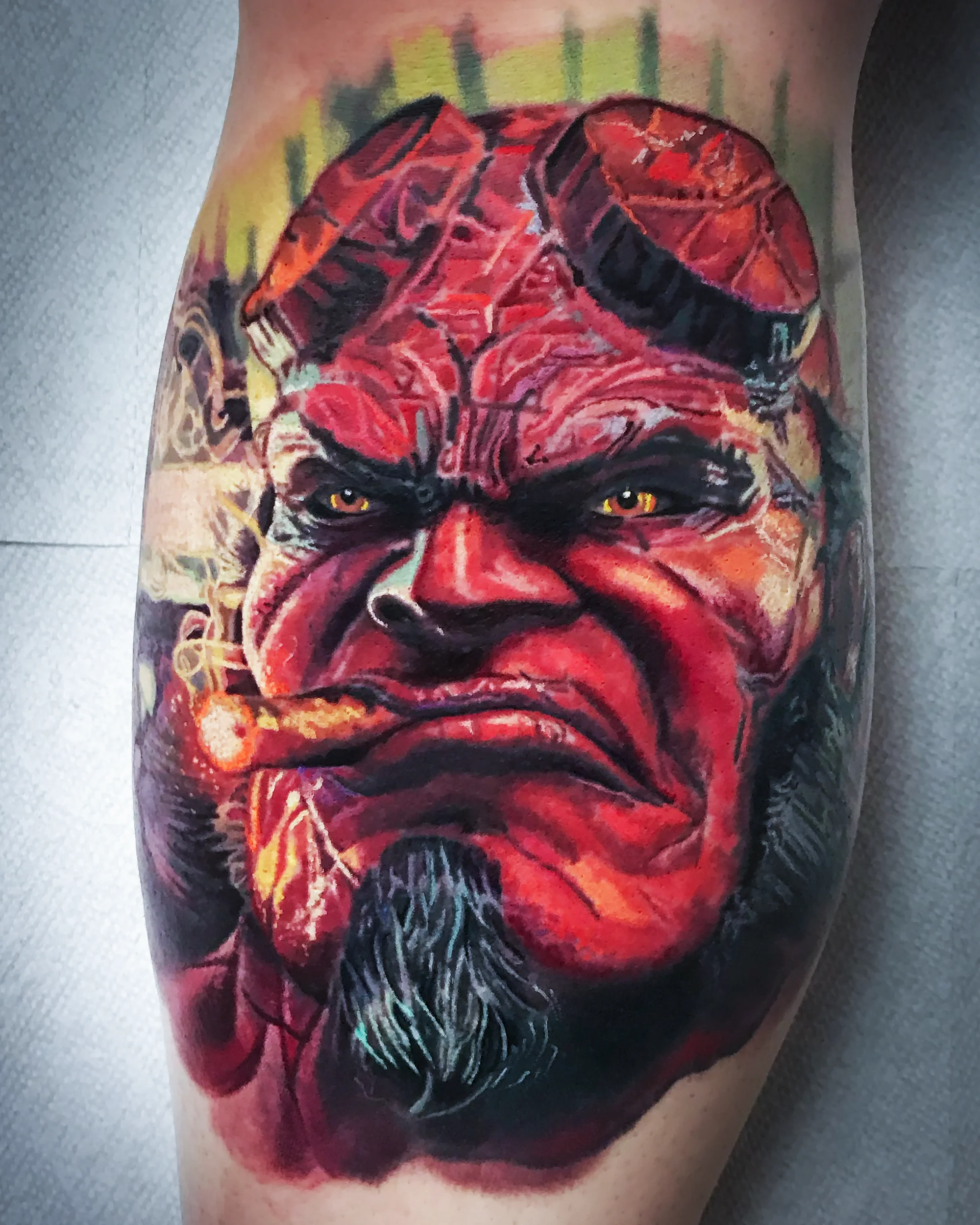 Color realism Hellboy portrait thigh tattoo by Austin tattoo artist Bobby Cupparo