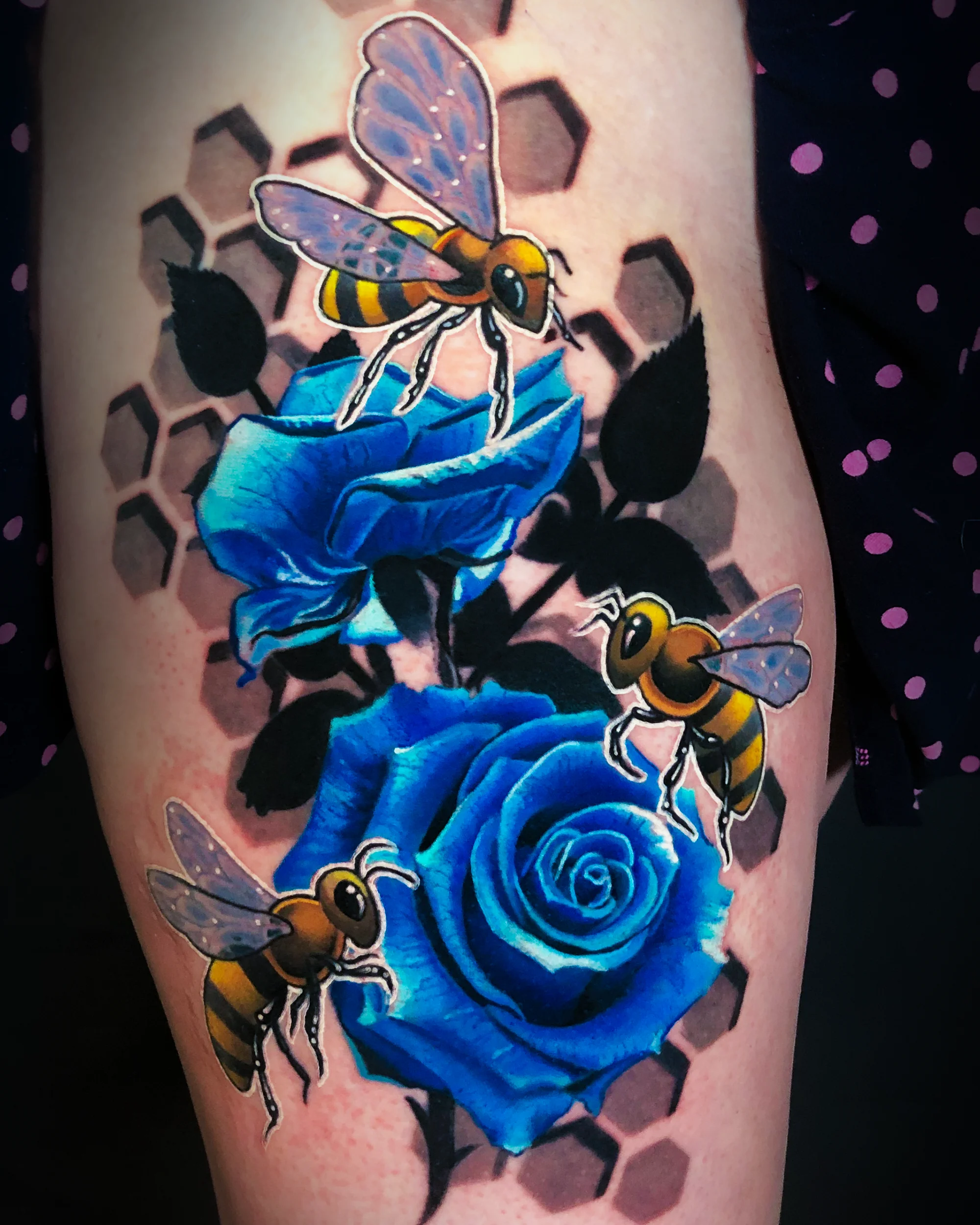Color realism bees blue roses honeycomb thigh tattoo by Austin tattoo artist Bobby Cupparo