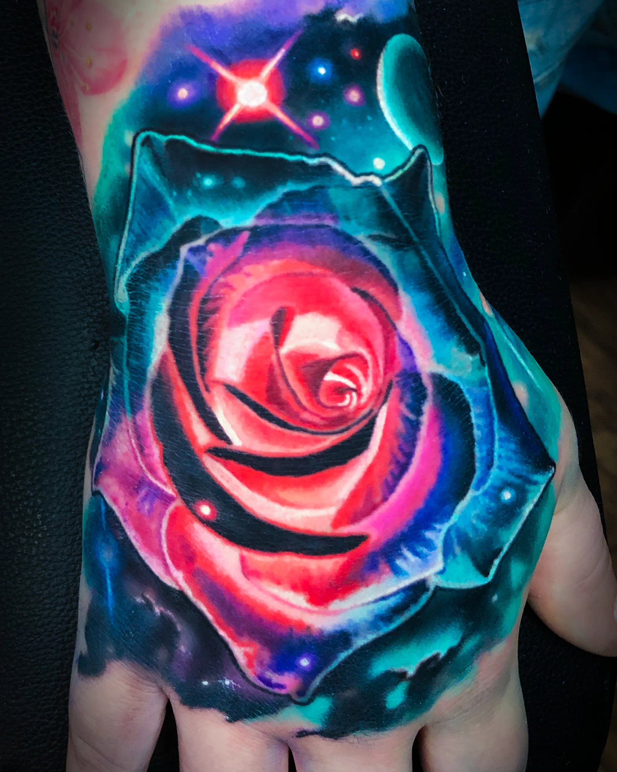 Galaxy rose hand tattoo