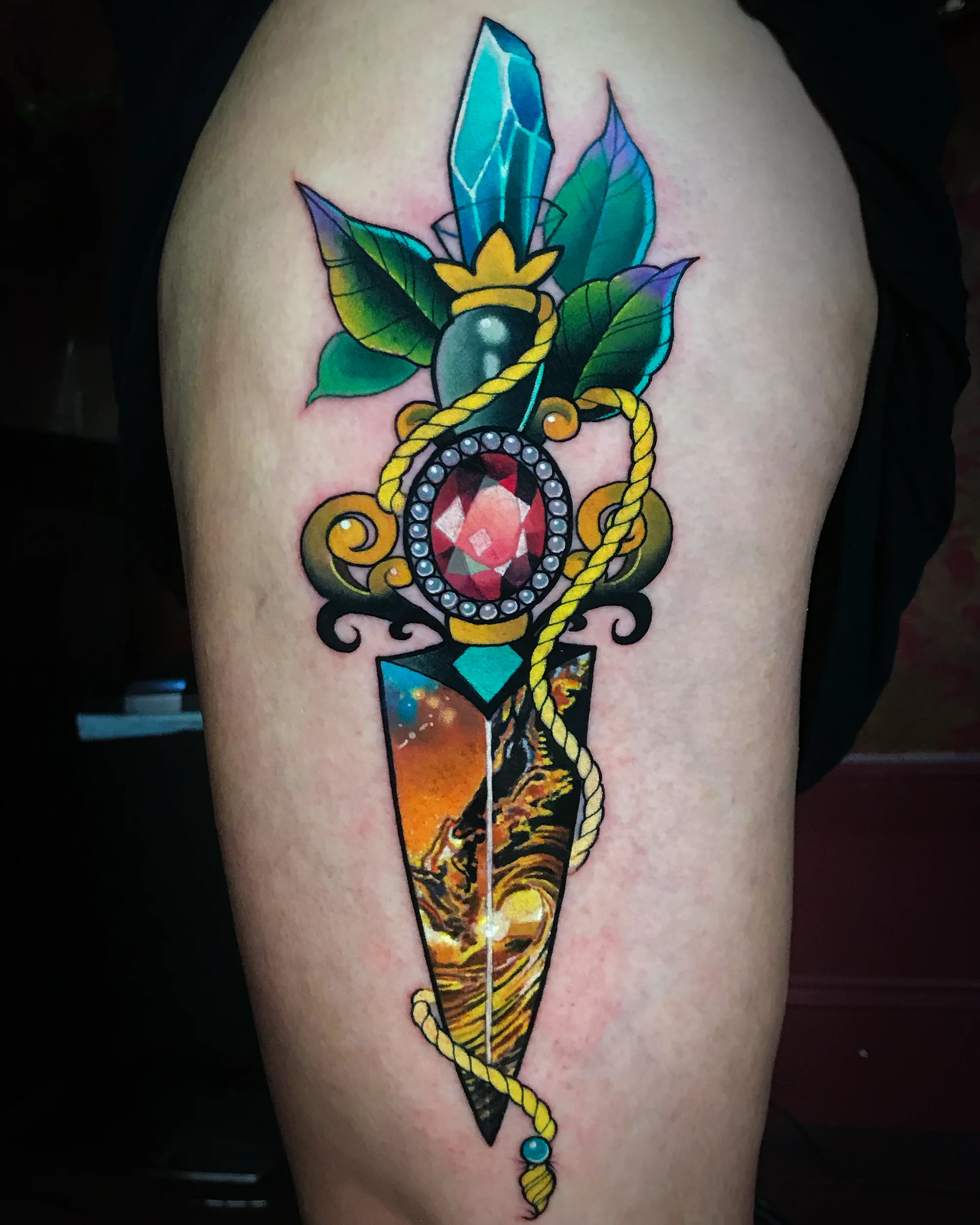 Color realism ornamental dagger gem crystal thigh tattoo by Austin tattoo artist Bobby Cupparo