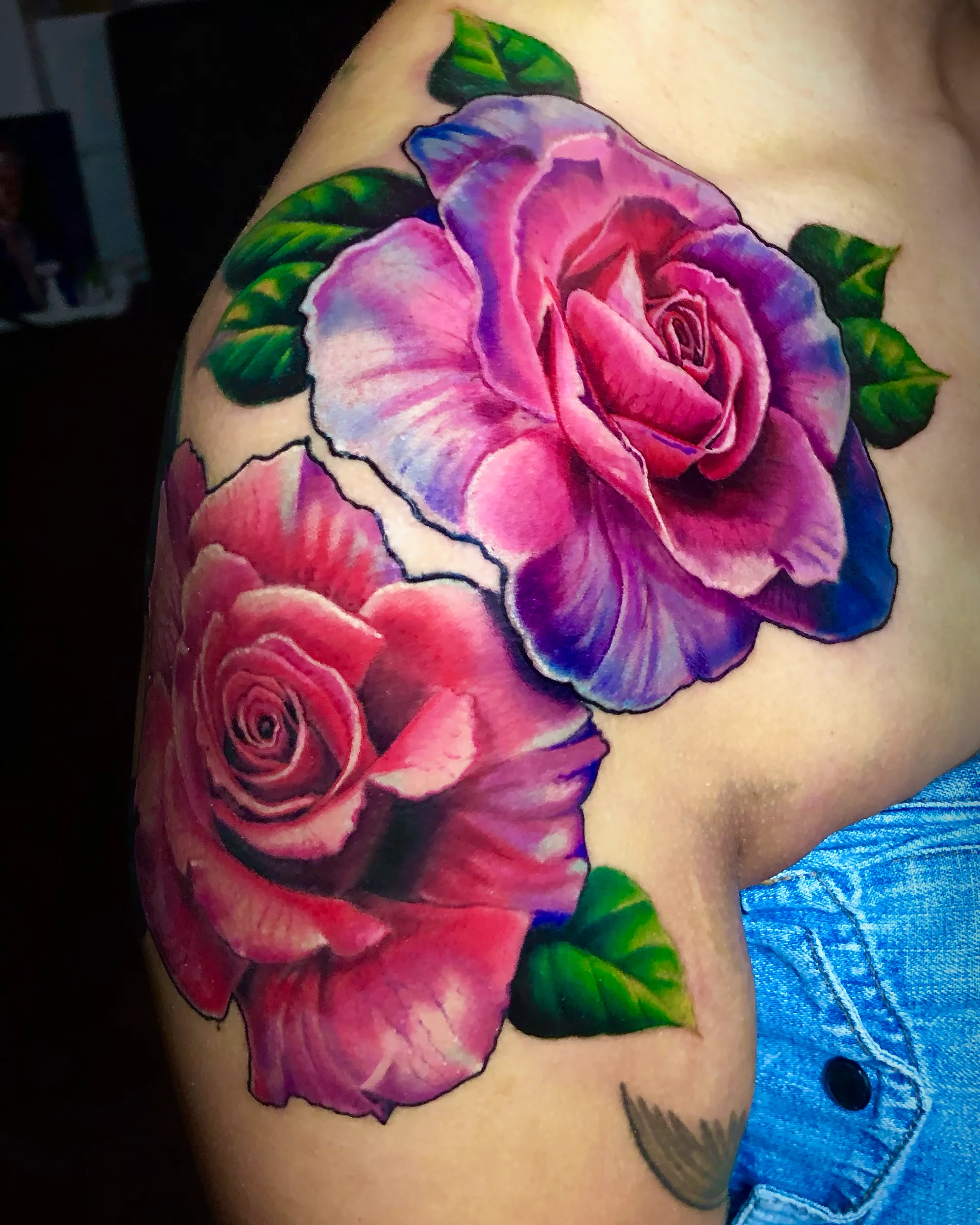 Color realism pink rose shoulder tattoo by Austin tattoo artist Bobby Cupparo