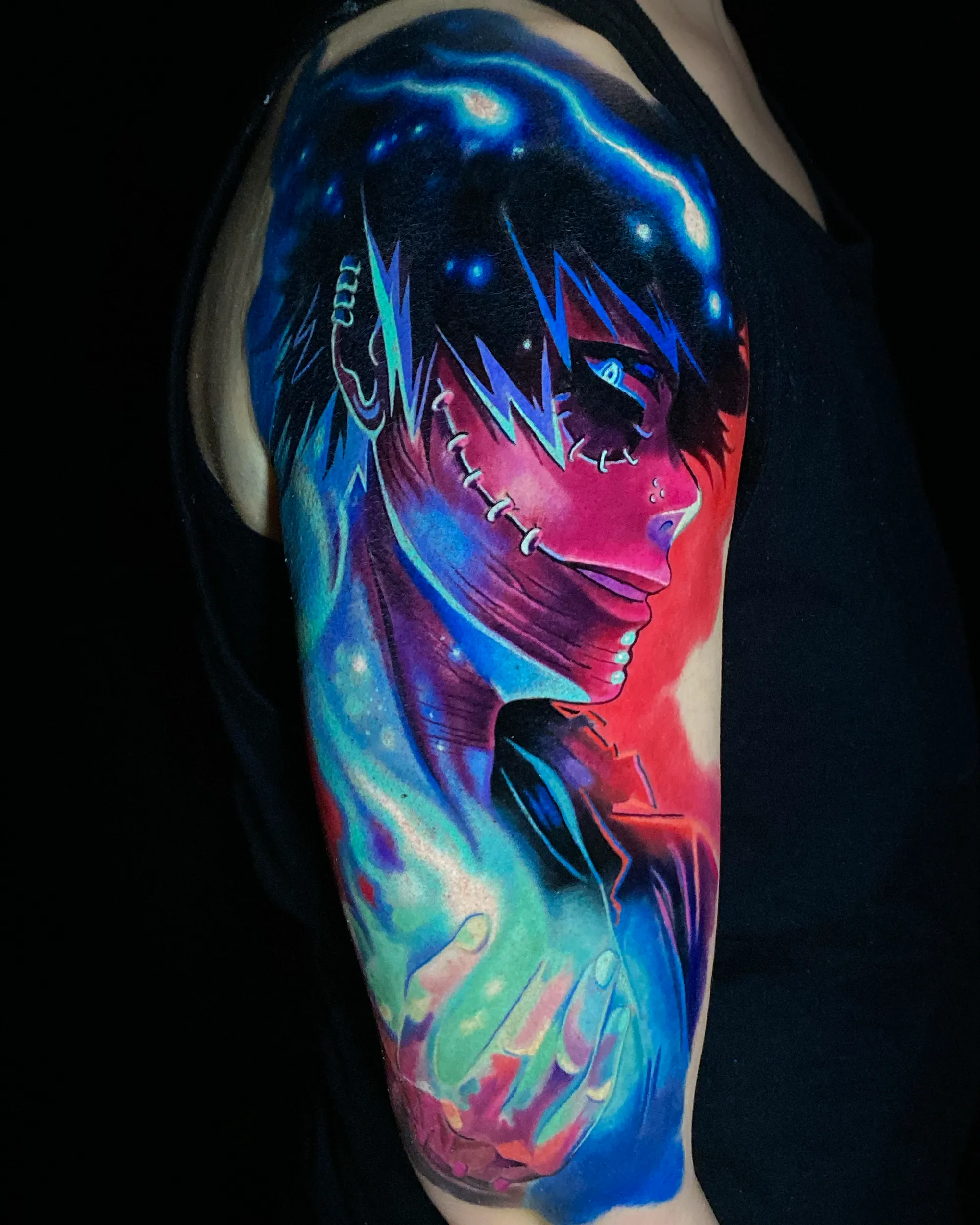 Surreal color anime portrait with galaxy cosmic upper arm tattoo by Austin tattoo artist Bobby Cupparo