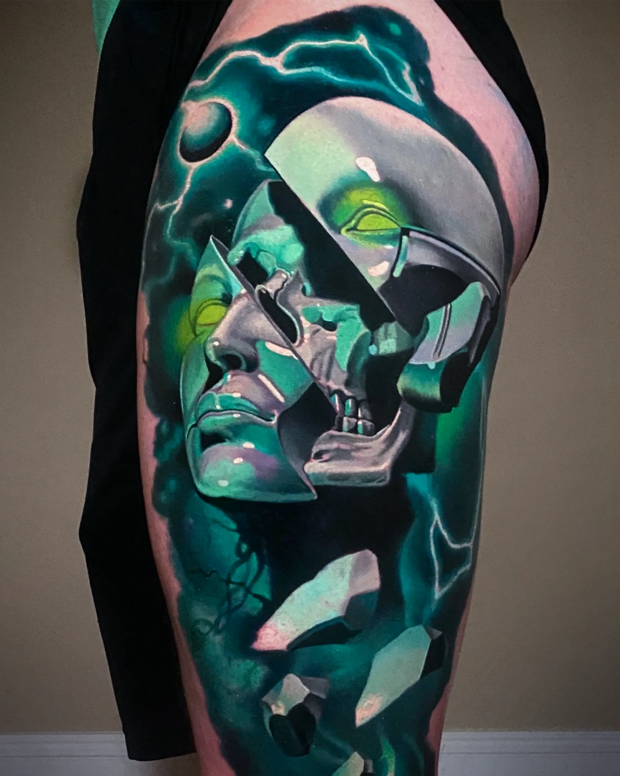 Surreal color broken statue skull reveal thigh tattoo by Austin tattoo artist Bobby Cupparo