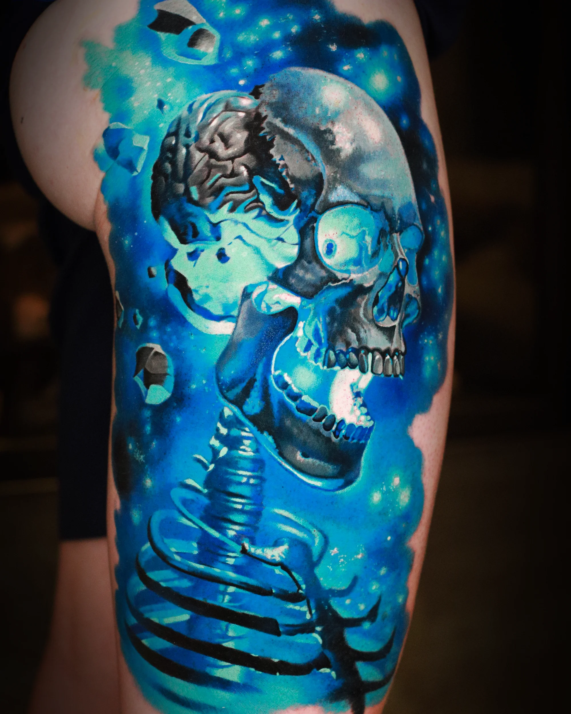 Color realism cosmic skeleton full figure galaxy thigh tattoo by Austin tattoo artist Bobby Cupparo