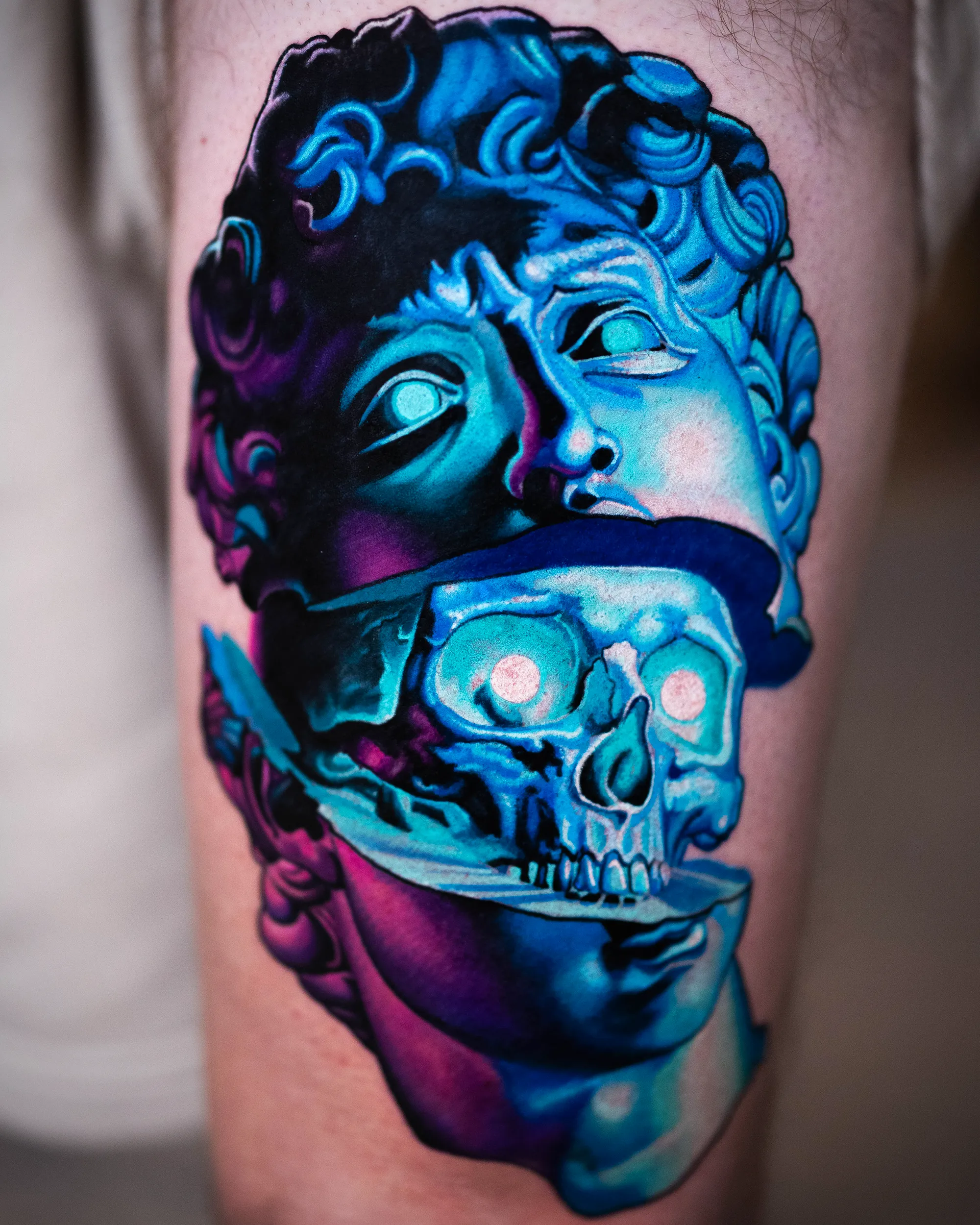 Surreal color David statue skull reveal thigh tattoo by Austin tattoo artist Bobby Cupparo