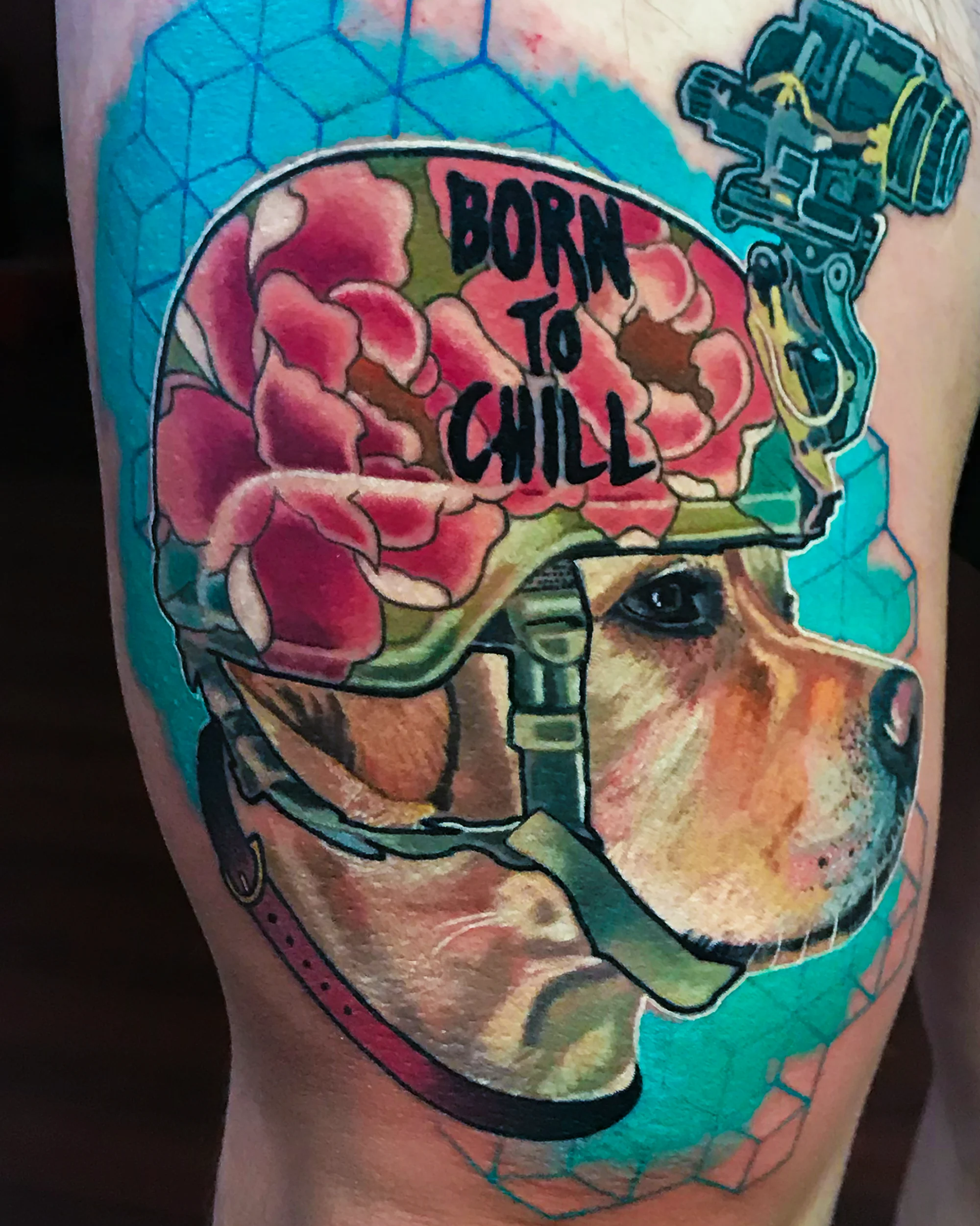 Surreal color Labrador dog in military helmet with Born to Chill lettering thigh tattoo by Austin tattoo artist Bobby Cupparo