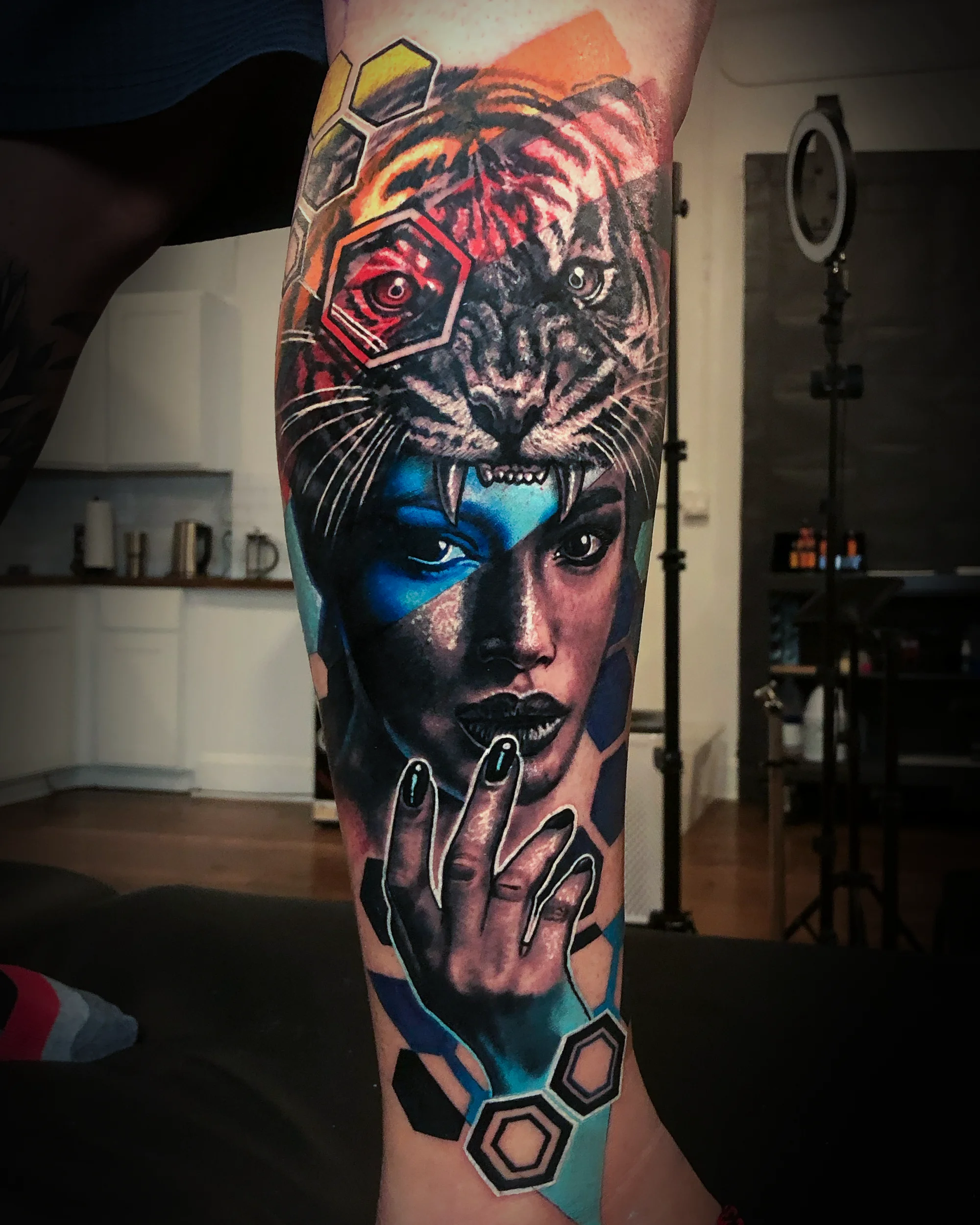 Surreal color realism female portrait with tiger forearm tattoo by Austin tattoo artist Bobby Cupparo