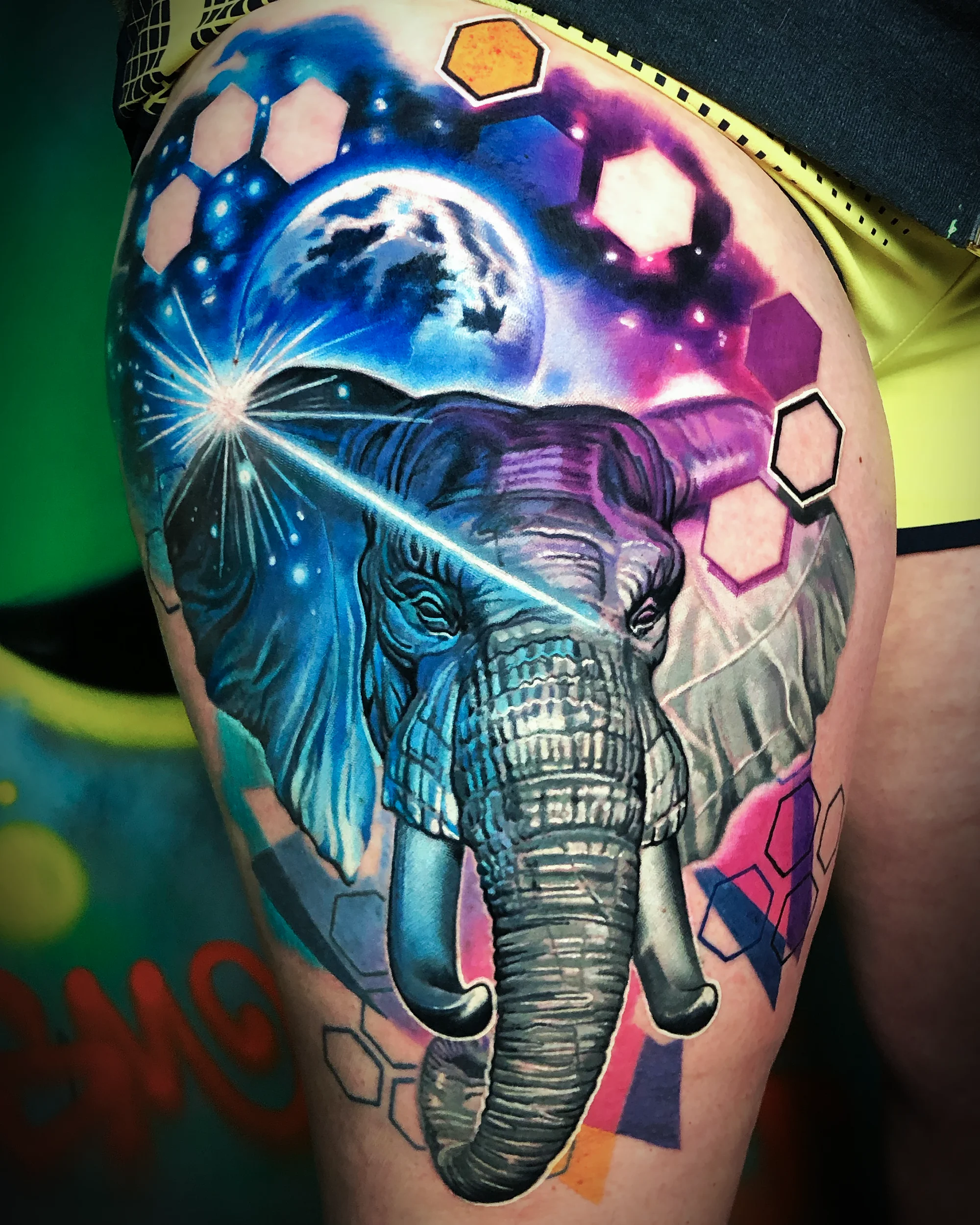 Galaxy elephant planet thigh tattoo
