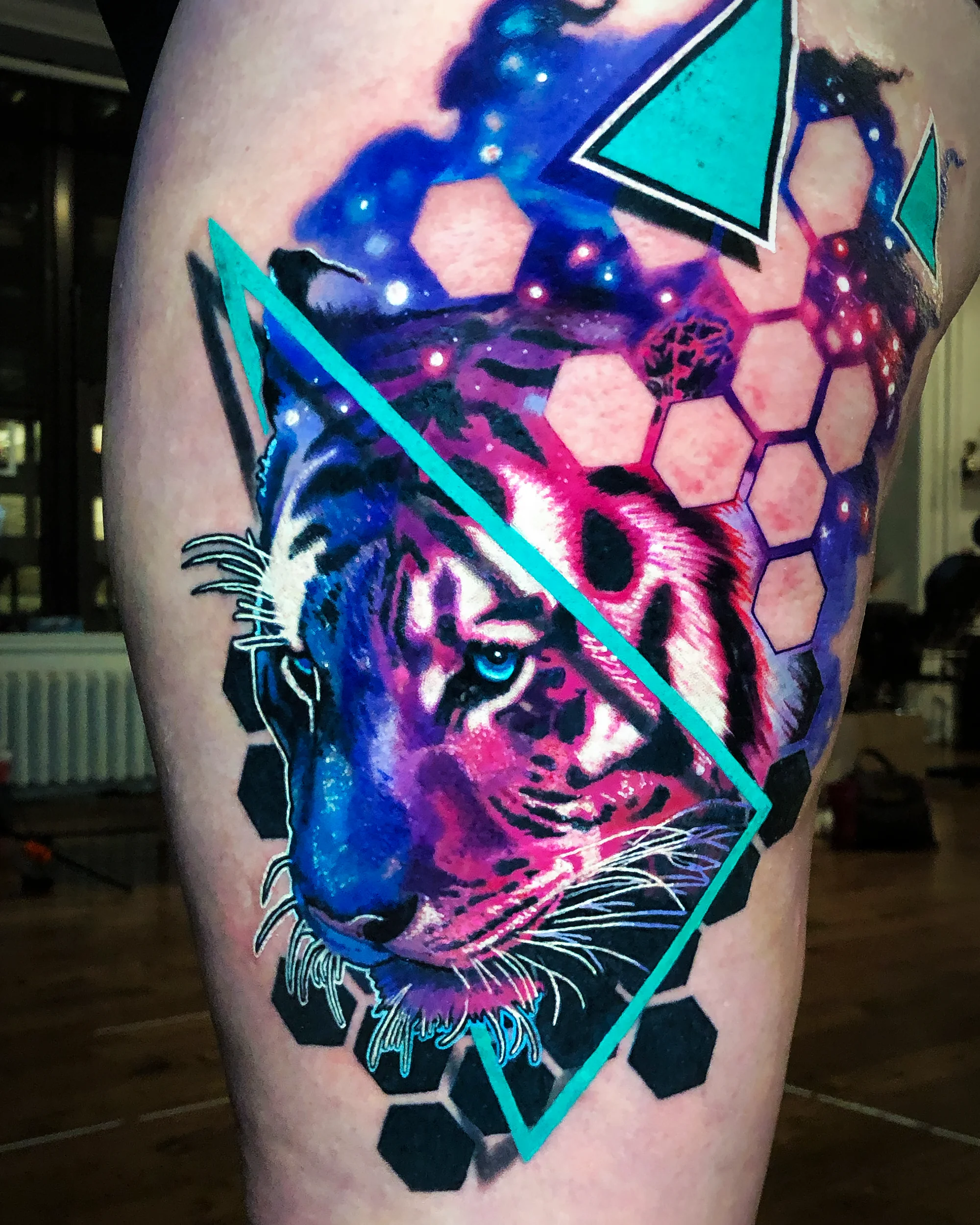 Galaxy tiger geometric thigh tattoo — follow on Instagram by Austin tattoo artist Bobby Cupparo