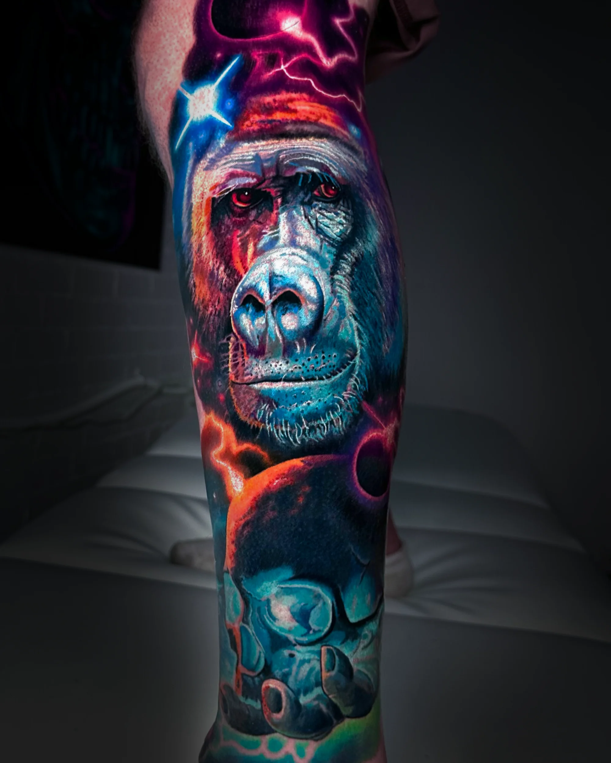 Color realism gorilla galaxy lightning calf tattoo by Austin tattoo artist Bobby Cupparo