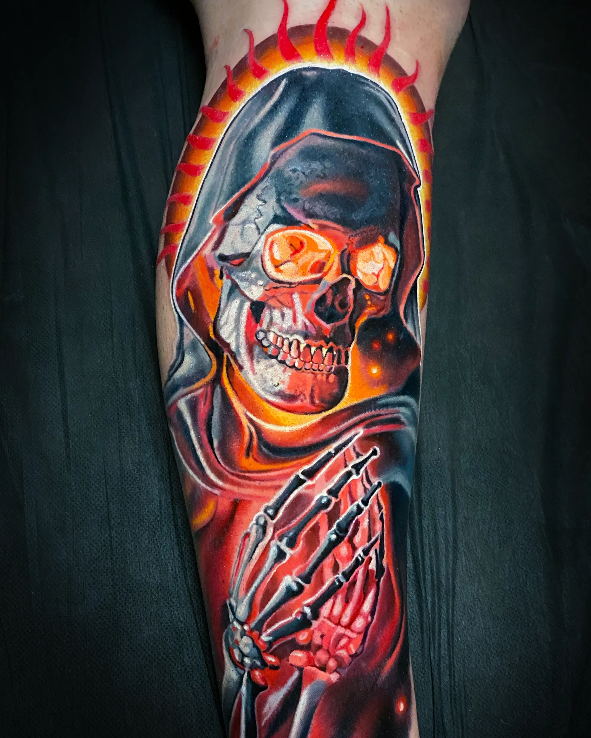 Color realism grim reaper fire halo forearm sleeve tattoo by Austin tattoo artist Bobby Cupparo