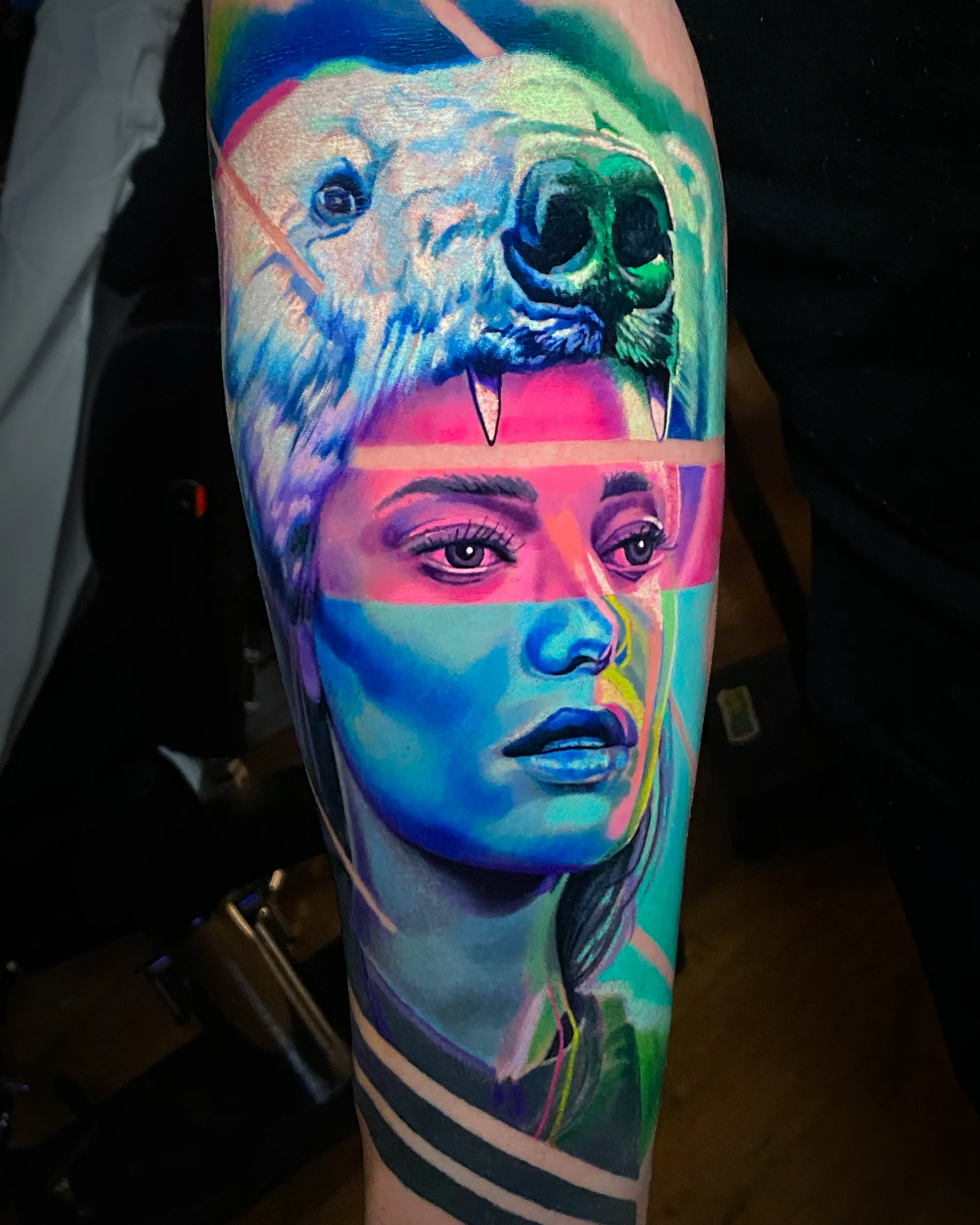 Surreal color polar bear with glitch female portrait forearm tattoo by Austin tattoo artist Bobby Cupparo
