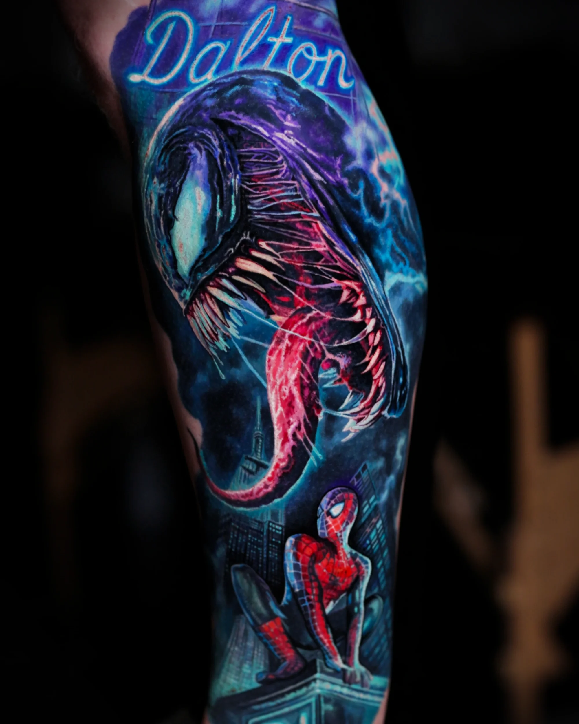Color realism Venom and Spider-Man leg sleeve tattoo by Austin tattoo artist Bobby Cupparo