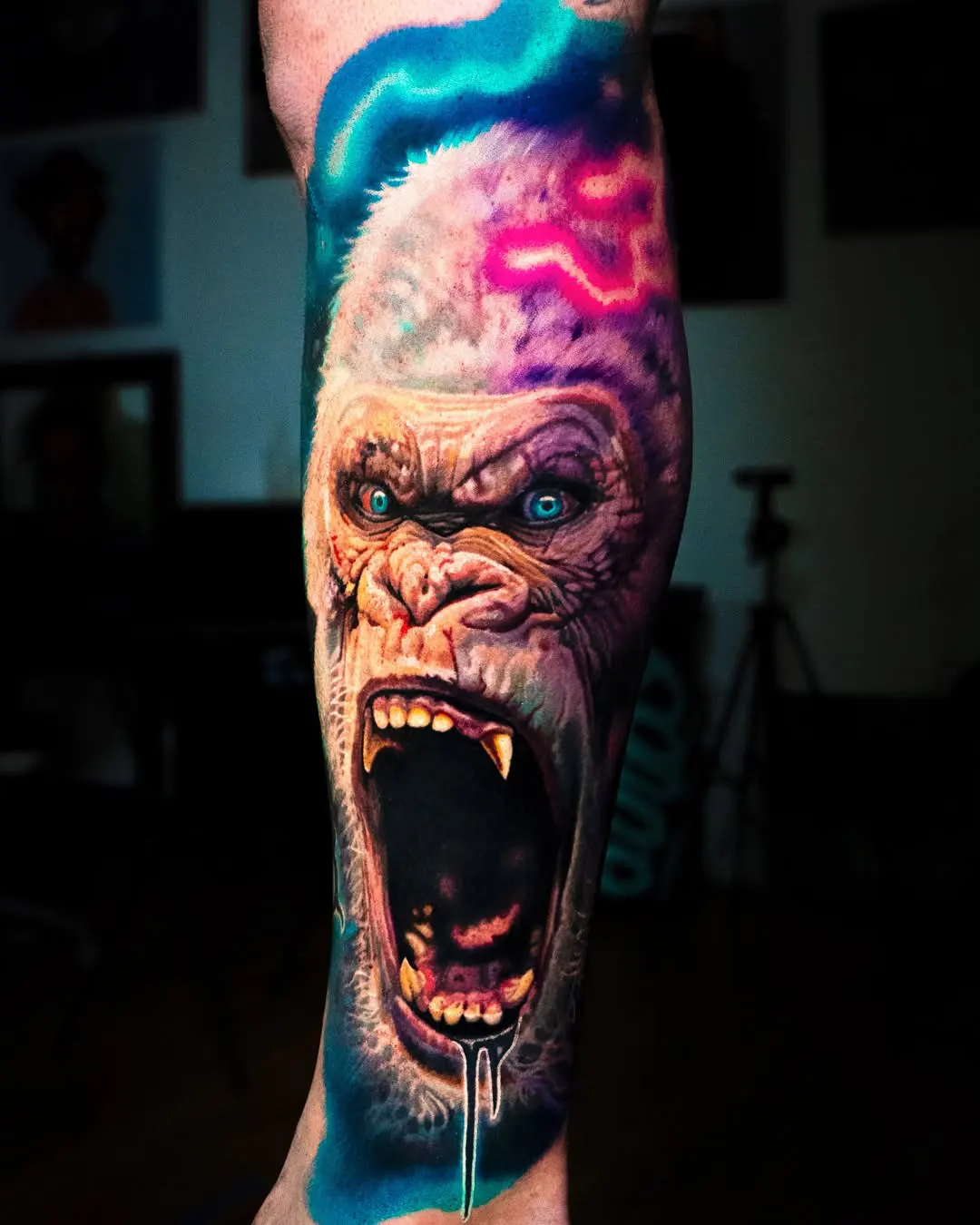 Surreal color wolf with Zelda Triforce upper arm tattoo by Austin tattoo artist Bobby Cupparo